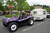 This vintage eriba puck trailer is towed by a vintage meyers manx vw dune buggy
