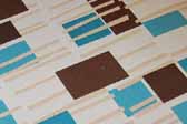 This photo shows a swatch of retro fabric with mid-century geometrics designs, for your vintage trailer