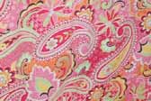 This photo shows a swatch of retro fabric with a 1960's psychedelic paisley pattern, for your vintage trailer
