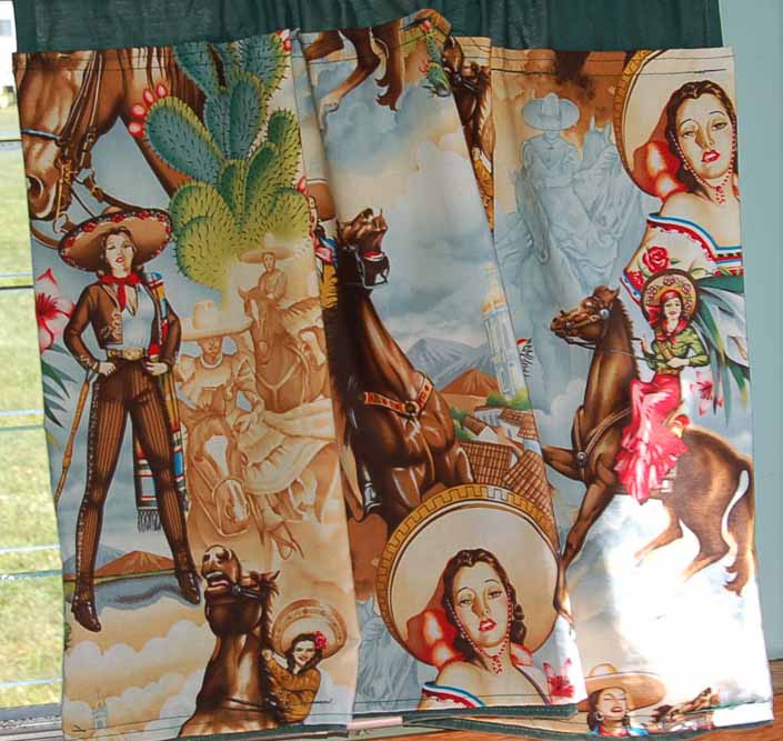 This photo shows a swatch of retro fabric with classy Cowgirls and Senoritas, for your vintage trailer