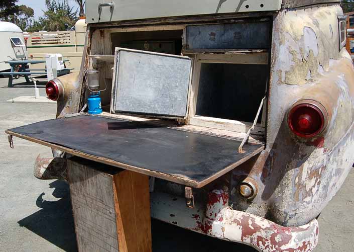 Cooking area and kitchen cabinets in a vintage 1954 Kompak trailer