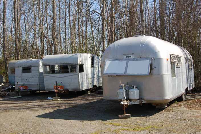 Vintage trailer junk yard in the woods, has a collection of rescued vintage trailers ready to be restored