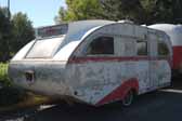 Original Aero Flite trailer in a vintage trailer storage yard is very restorable and would be a great restoration project
