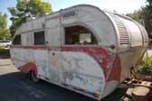 Classic Aero Flite trailer stored in a vintage trailer Junk Yard awaiting restoration