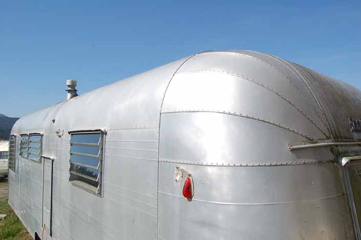 Vintage trailer junk yard has a very restorable Streamline vintage trailer