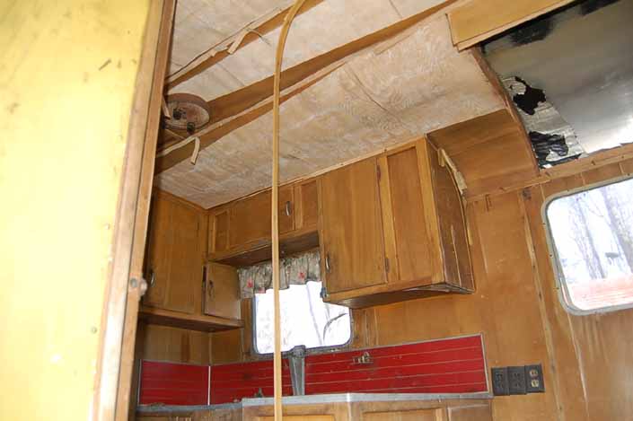 Palace vintage trailer found in a vintage trailer Storage Yard with its original ceiling paneling and kitchen wood work