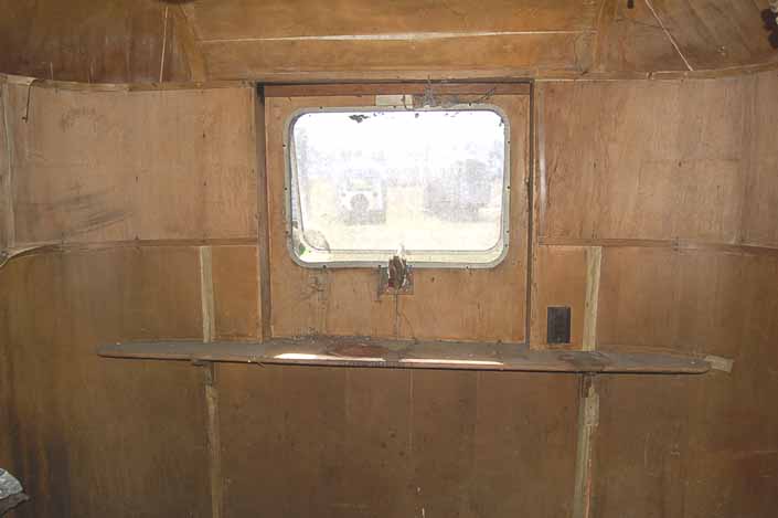 Palace vintage trailer found in a vintage trailer Storage Yard still has its original interior wood paneling