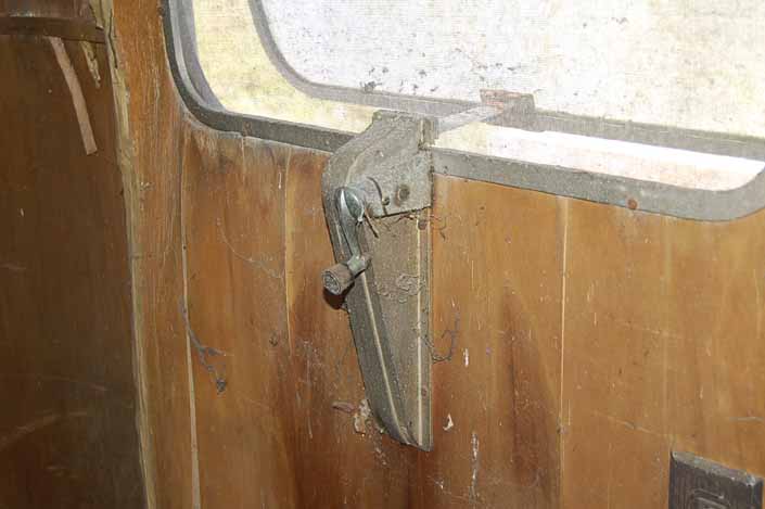 Palace vintage trailer found in a vintage trailer Storage-Yard still has its original window crank out mechanism hardware
