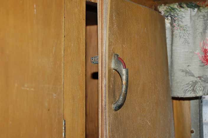 Palace vintage trailer found in a vintage trailer Storage Yard has its original cabinet door latch handles