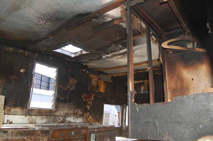 Shasta 16SC trailer in a vintage trailer Storage Yard has been gutted by a massive fire in the interior areas