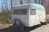 Vintage Serro Scotty trailer abandoned in a vintage trailer storage yard