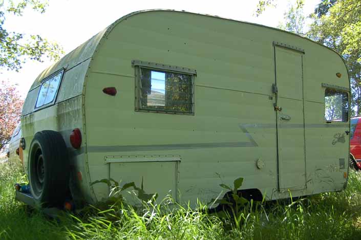 Clean original Shasta trailer in a vintage trailer StorageYard would be a great restoration project