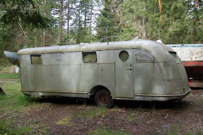 Classic Spartan Manor trailer in a vintage trailer Storage Yard would be a great restoration project