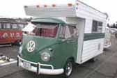 Very nicely built truck-based custom camper is a large camper shell mounted on a vintage Volkswagen Bus